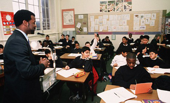 Black teacher with mixed class.