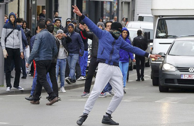 One of the nonwhites taunts the police
